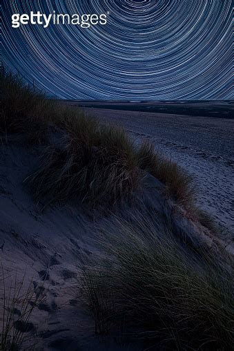 Digital Composite Image Of Star Trails Around Polaris With Summer