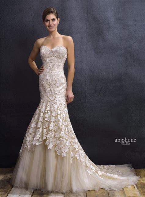 A Beautiful Light Gold Mermaid Wedding Gown With Bold Floral Lace And