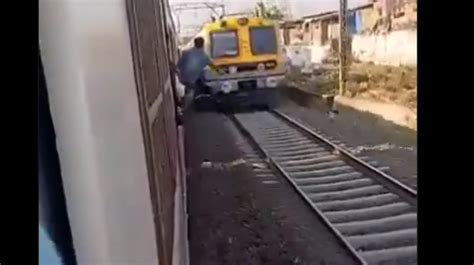 Trending Viral Video Man Was Caught Performing Stunts On Mumbai Local