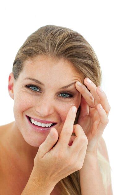 Premium Photo Smiling Woman Putting A Contact Lens