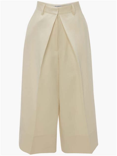 Pleat Front Wide Leg Cropped Trousers In White Jw Anderson Us