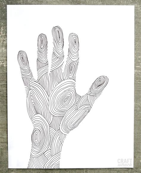 a black and white drawing of a hand with spirals on the palm is shown