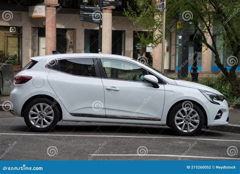 Profile View Of New White Renault Clio Parked In The Street Editorial