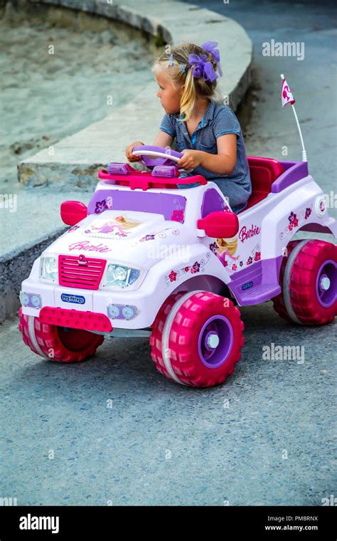 Young Girl Aged About 4 Driving Her Pink And Purple Barbie Suv Electric