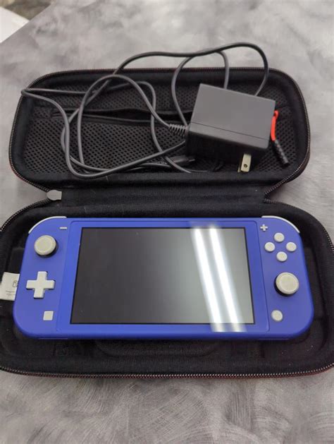 NINTENDO SWITCH LITE IN BLUE MODEL HDH 001 Very Good Axel S Pawnshop