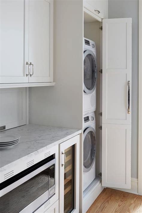Galley Style Kitchen With Hidden Stacked Washer And Dryer Efficient