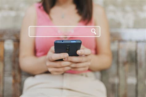 Premium Photo Millennial Woman Using Phone To Find Information Online