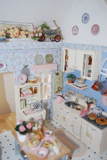 A Doll House Kitchen With Blue And White Walls