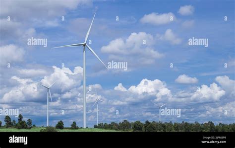 Wind Turbines For Electric Power Generation On Farmland Stock Photo Alamy