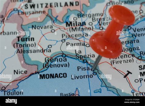 A Red Pin Stuck Into A Map Of Western Europe Pinpointing The Location