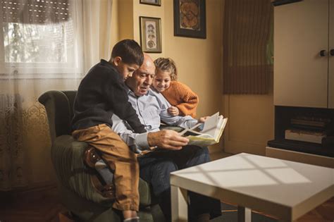 Grandpa Reading Stories To Grandkids Stock Photo Download Image Now