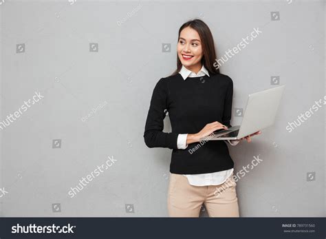 Pleased Asian Woman Business Clothes Holding Stock Photo