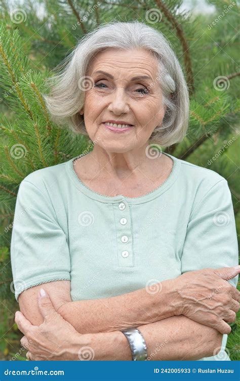 Portrait Of Happy Smiling Senior Woman Posing Outdoors Stock Image