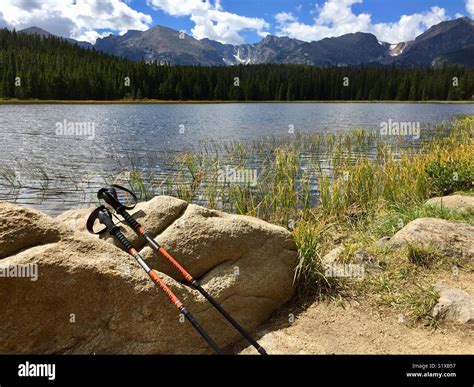 Trekking Poles Resting On Rock After Hike To Bierstadt Lake In Rocky