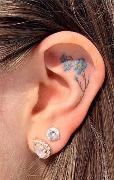 Whispered Ink 40 The Beauty Of Ear Tattoos Blue Flower Inside Ear Tattoo I Take You Wedding