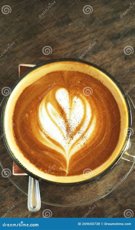 A Cappuccino with Fresh Milk Frothed in the Shape of a Leaf. Stock Photo - Image of table ...