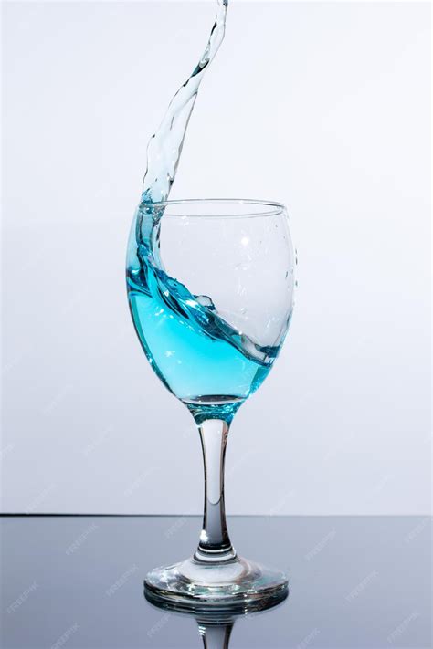 Premium Photo Beautiful Splash Of Blue Liquid In A Glass