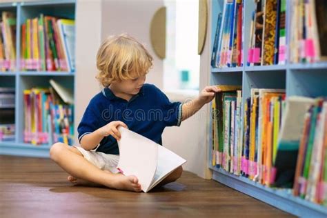 Child in School Library. Kids Reading Books Stock Photo - Image of ...