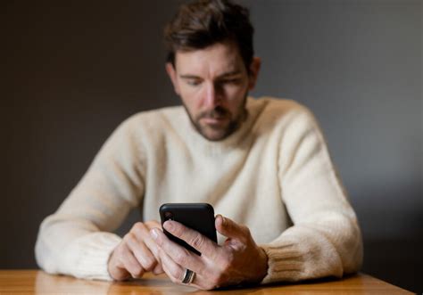 Man Scrolling On His Phone Alone Graphics For The Church