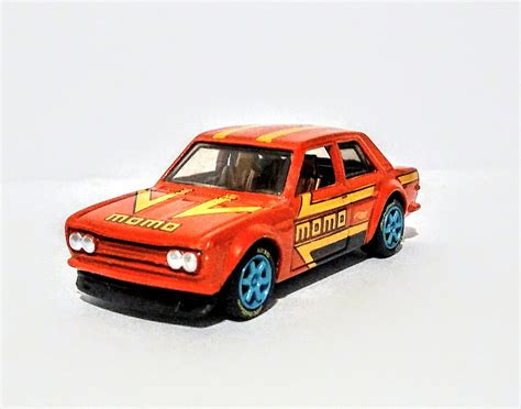 Custom Hot Wheel Scale For JDM Fans Red Datsun With Yellow MOMO Graphics Painted Silver