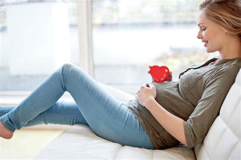 Pregnant Woman With Heart Shape On Tummy Photograph By Ian Hooton