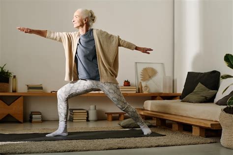 Premium Photo | Grandma doing exercises in bedroom