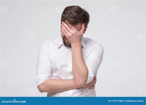 Facepalm Disappointed Man Covering His Face With His Hand Stock Photo