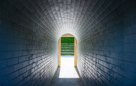 Perspective View In The Tunnel With Natural Light At The End Of The