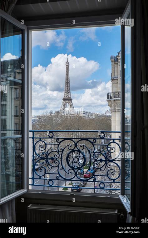 The Eiffel Tower Paris France Viewed Through An Open Window Stock