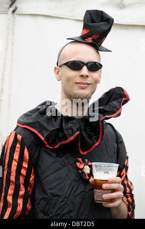 Festival Goers Enjoying A Drink In A Hammock In The Coca Cola Share A