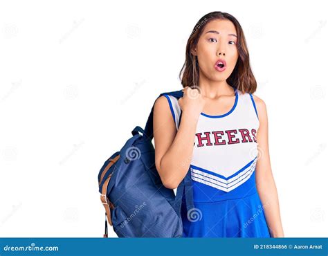 Young Beautiful Chinese Girl Wearing Cheerleader Uniform Holding