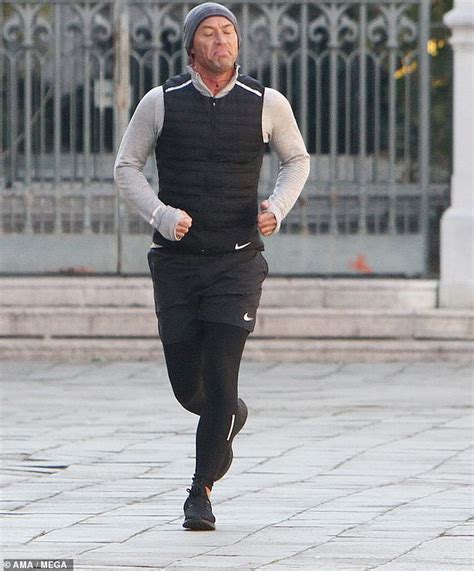 Jude Law Works Up A Sweat On A Solo Run As He Takes A Break From