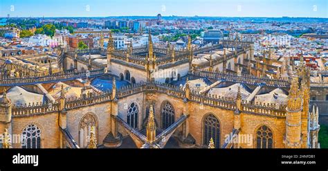 Giralda Tower Overlooks The Giant Seville Cathedral With Its Stone