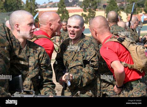 A Us Marine Corps Drill Instructor Screams At A Marine Recruit During