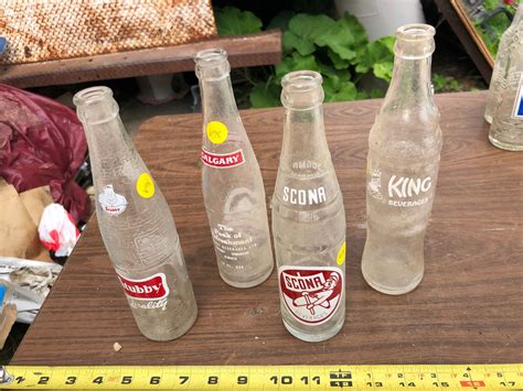 4 Vintage Glass Pop Bottles Schmalz Auctions