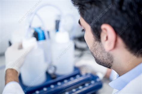 Lab Assistant Using Equipment Stock Image F020 3326 Science Photo