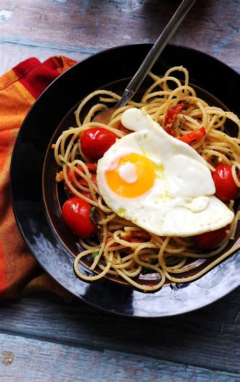 Spaghetti With Fried Eggs Cherry Tomatoes And Roasted Red Peppers