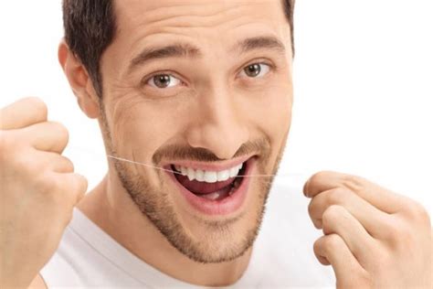 Como usar el hilo dental correctamente Clínica dental Nadal