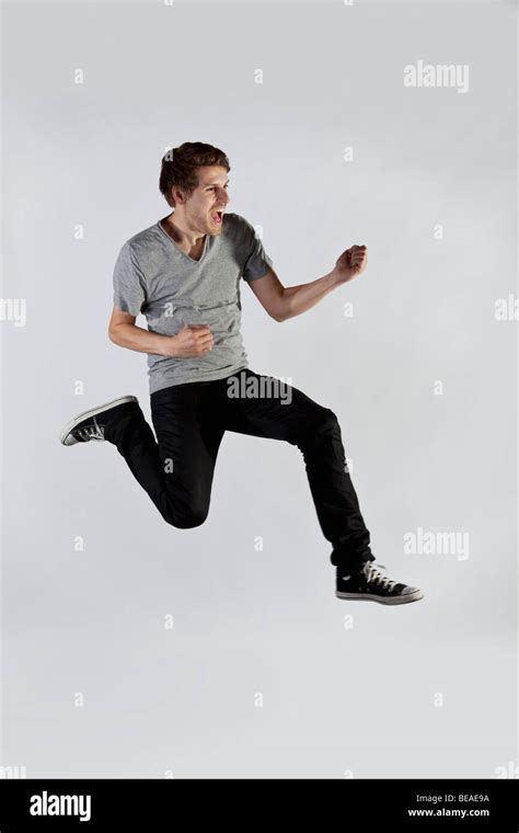 man jumping  mid air  excitement stock photo alamy