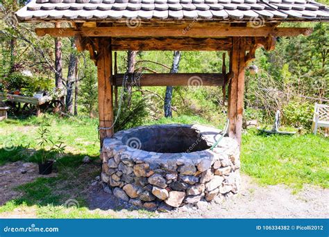 Old Stone Well of a Rustic Garden Stock Photo - Image of country ...