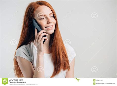 Close Up Of Smiling Attractive Girl With Long Hair Talking On Mobile