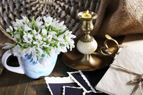 Premium Photo Composition With Beautiful Snowdrops In Vase Candle Old