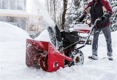 Senior Man Using SnowBlower After a Snowstorm | Blain's Farm & Fleet Blog