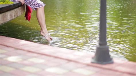 The Girl Splashes Her Feet In The Water Stock Video Video Of Girl