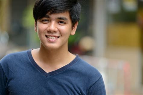 Premium Photo | Portrait of young handsome filipino man in the streets ...