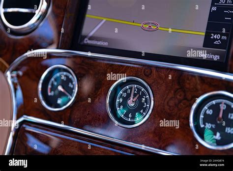 Car analog clock in dashboard Stock Photo - Alamy