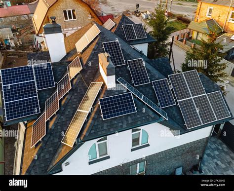 Aerial View Of Solar Photovoltaic Panels On A Own House Roof In Small