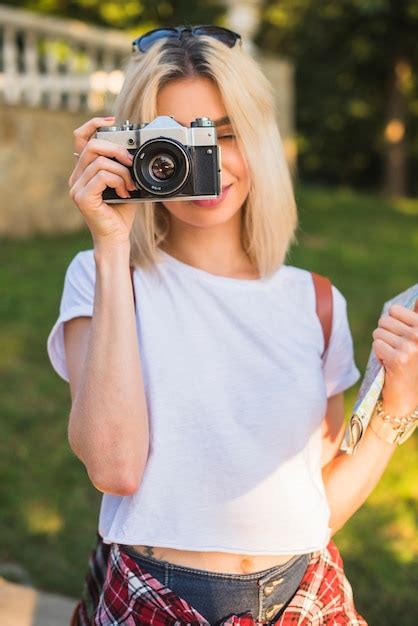 Free Photo Blonde Tourist With Camera