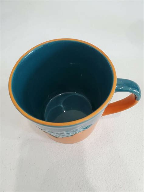 2006 Starbucks Orange And Blueish Green Flowers 17 Fl Oz Coffee Mug Cup