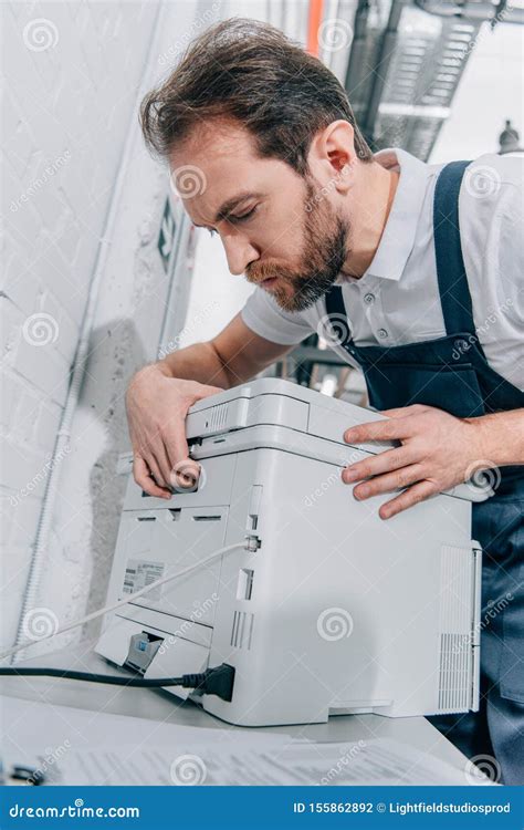 Serious Male Handyman Repairing Copy Machine Stock Photo Image Of